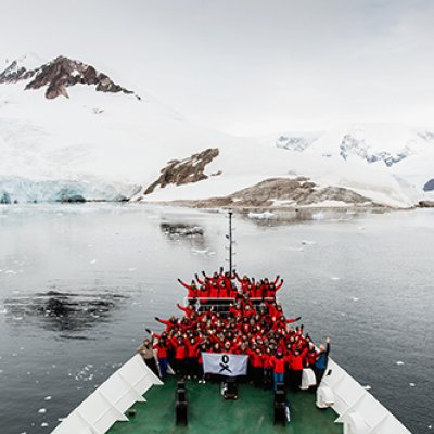 Scientists-on-bow-of-ship-in-Antarctica